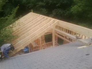 Framing a new roof addition that ties into an existing shingle roof in Bradford